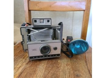 Vintage Polaroid Camera And Flash