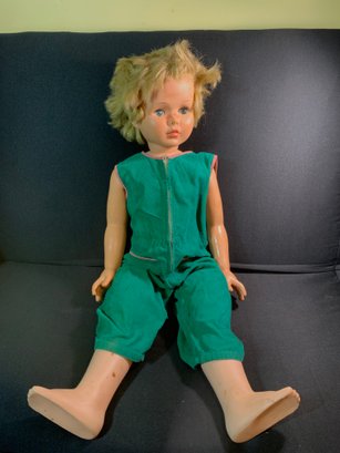 Vintage Child Doll In A Green Corduroy Jumpsuit