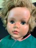 Vintage Child Doll In A Green Corduroy Jumpsuit