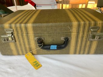 Vintage Suitcase With An Old Frontier Airlines Luggage Tag