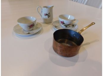 Tea Set And A Copper Pot