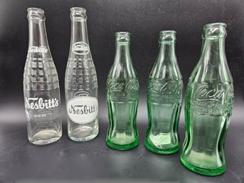 M206 - Soda Bottle Lot - Coca-cola 8oz & Nesbitts 10oz