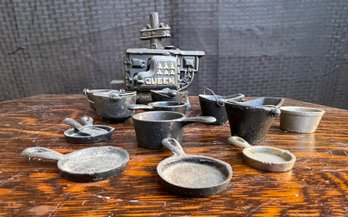 Assortment Of Cast Iron Pots And Stove