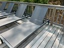 Set Of Four Mesh And Metal Outdoor Chaise Lounges