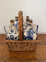 Set Of 4 English Ceramic Decanters In Wicker Basket