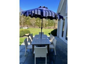 Outdoor Table And 8 Chairs. Includes Umbrella And Stand.