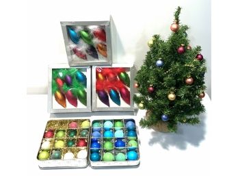 Colorful Glass And Plastic Ornaments And Small Christmas Tree
