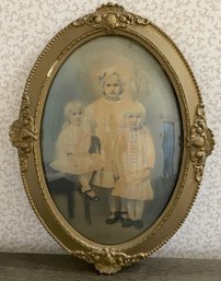 Antique Family Photo In Oval Frame