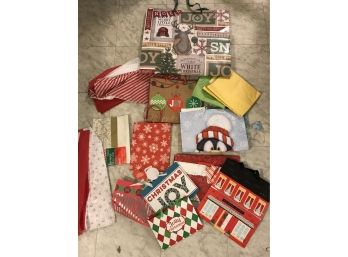 Lot Of Assorted Christmas Gift Bags And Tissue Paper