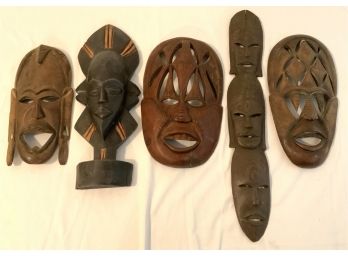 4 AFRICAN MASKS & 1 ON PEDESTAL 10 1/2-20 INCHES LONG- WE CAN SHIP!