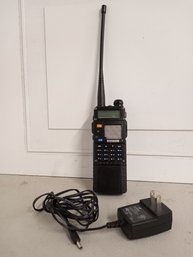 A Baofeng Brand Walkie Talkie Hand Held Radio With Plug/charger