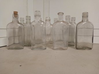 11  Antique 'flask' Style Bottles.
