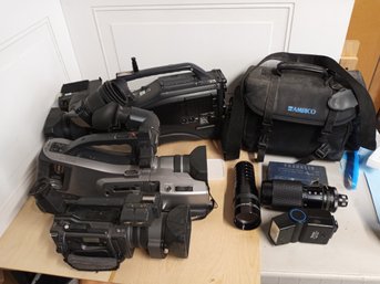 3 Video Cameras And Other Photography Lenses Etc.