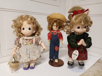 3 Dolls With Display Stands. Two Appear To Still Have Their Tags.