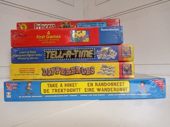 5 Children's Board Games. Never Opened, Still In Shrink Wrap. See Pictures For Contents Of Lot