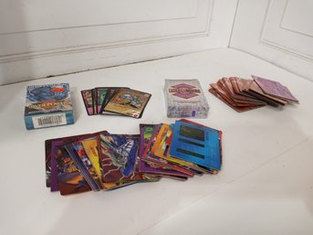 An Assortment Of Over Power And Wild Storm Cards.