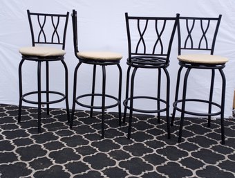 4 Black Metal Barstools. Will Need Re-upholstering, One Stool Has No Covering. The Chairs Do Swivel.
