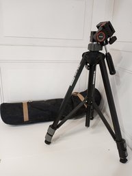 A SLIK Tripod And Carrying Case.