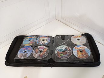 Large Collection Of Dvds And A Zippered Portfolio.