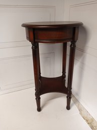 Wooden End Table With Circular Top.