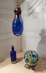Glass Decor. A Handing Bottle, A Vase And A Globe.