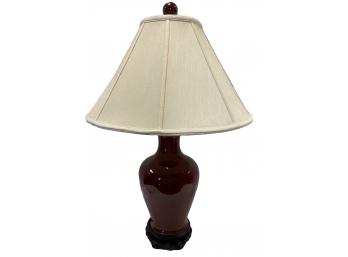 CHINESE OXBLOOD RED PORCELAIN LAMP WITH LINEN SHADE