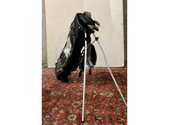 Black Stand Up Golf Bag With Assorted Golf Clubs