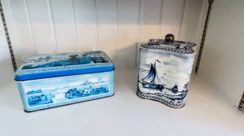 Two Blue And White Tins