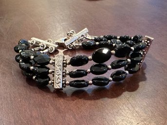 Sterling Silver And Black Onyx Triple Strand Bracelet With Lobster Clasp