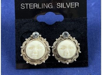 Sterling Silver Carved Bone Moonface Earrings With Blue Topaz,