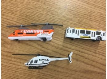 Two Model Helicopters And A Model Airport Transport Bus