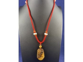 Asian Carved Tigers Eye Pendant On Adjustable Red Cord