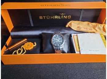 Stuhrling Mens Watch, Black Face Stainless Steel Band, With Day Month Seconds And Moon Phase, Condition Is Lik