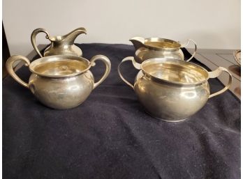Two Pairs Of Sterling Silver Sugar Bowls And Creamer