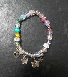 A BRAND NEW CUTE CORORFUL CHARM BRACELET. GREAT FOR KIDS AND TEENS
