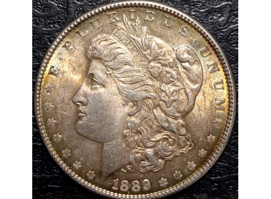 GOLDEN TONED UNCIRCULATED 1889 MINT MORGAN SIVER DOLLAR