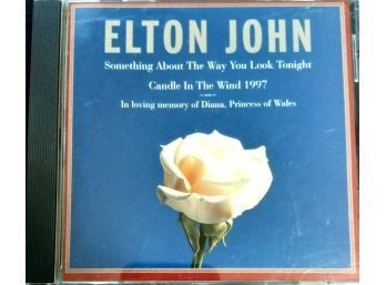 ELTON JOHN/SOMETHING THE WAY YOU LOOK TONIGHT. THE CD HAS A FEW LIGHT SCUFF MARKS