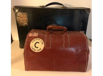 Blue English Revelation Suitcase And A Brown Leather Travel Bag