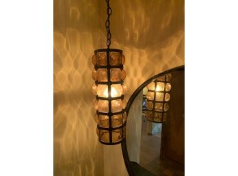 Pair Of Outstanding Mid Century Iron And Caged Amber Glass Hanging Lights