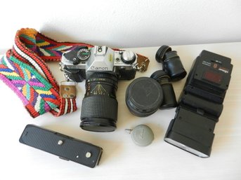 Canon SLR AE-1 Camera, Autowinder, Extra Lens, Flash, Film Holders    D41