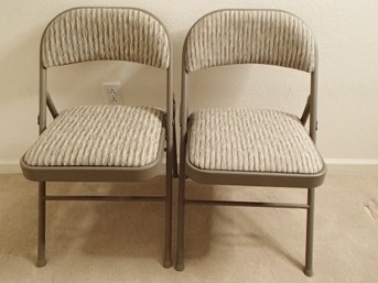 Two Folding Padded Metal Chairs