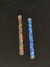 Two Six Inch Long Tubes Of Various Colored Plastic Beads, Amber Shades And Blue Shades