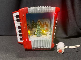 MUSIC BOX Lighted Holiday Accordion With Santa Winter Theme Movement And Lights,  Plays 4 Different Xmas Songo