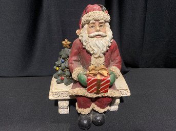 2 Piece Decorative Resin Santa On A Park Bench 10 In Tall And 7 In Wide.