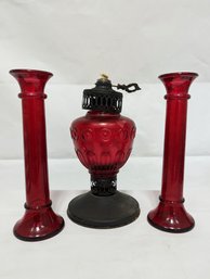 Red Glass Oil Lamp And Two Red Glass Candle Pillars