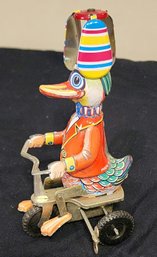 Vintage Wind-Up Litho Carnival Duck Riding Bike