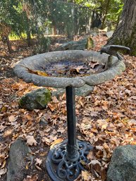 Metal And Cement Birdbath With A Bird Attached