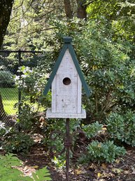 A Collection Of Birdhouses And Garden Structures