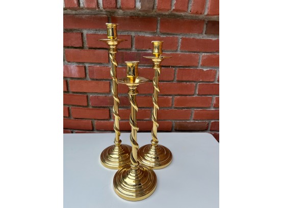 Set Of Three Brass Candlesticks With Twisted Brass And A Solid Base
