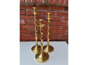 Set Of Three Brass Candlesticks With Twisted Brass And A Solid Base